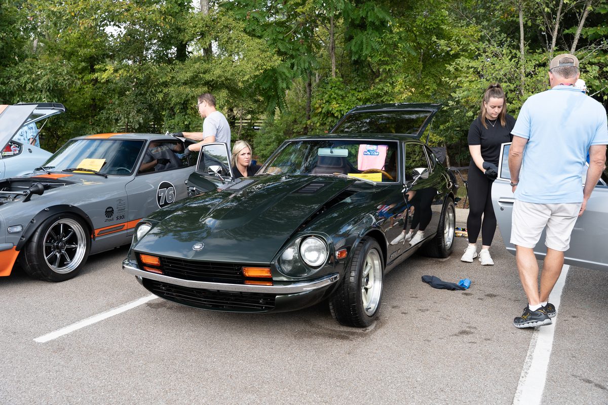 Allie-Gator, a dark green Datsun 280Z restored by SoFlo Z Club, at a ZCON show field