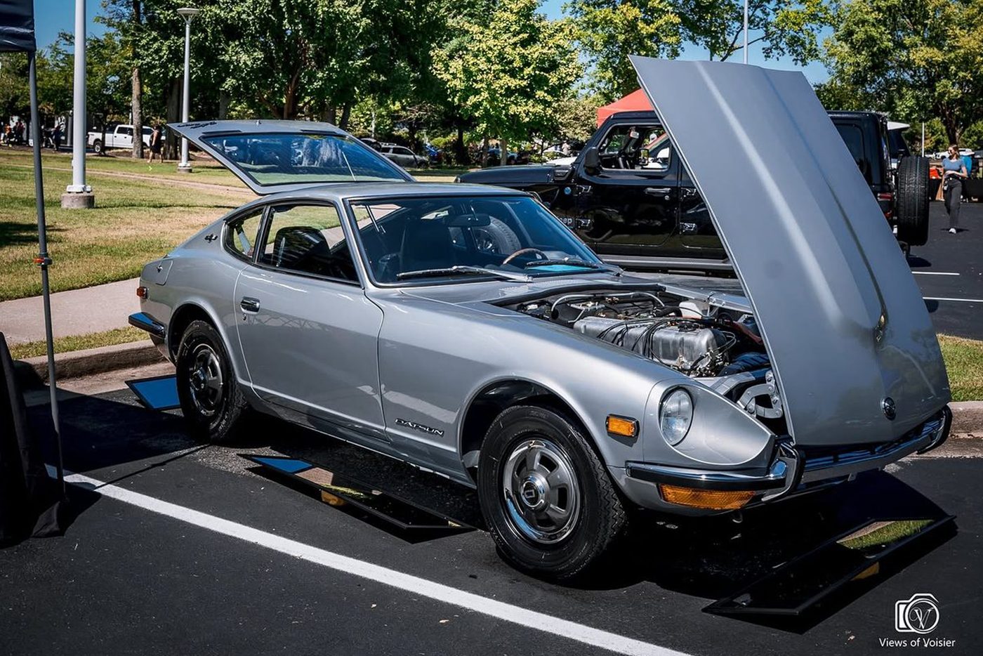 The Celestial, a silver Series 1 Datsun 240Z restored by SoFlo Z Club, hood raised showing the engine bay