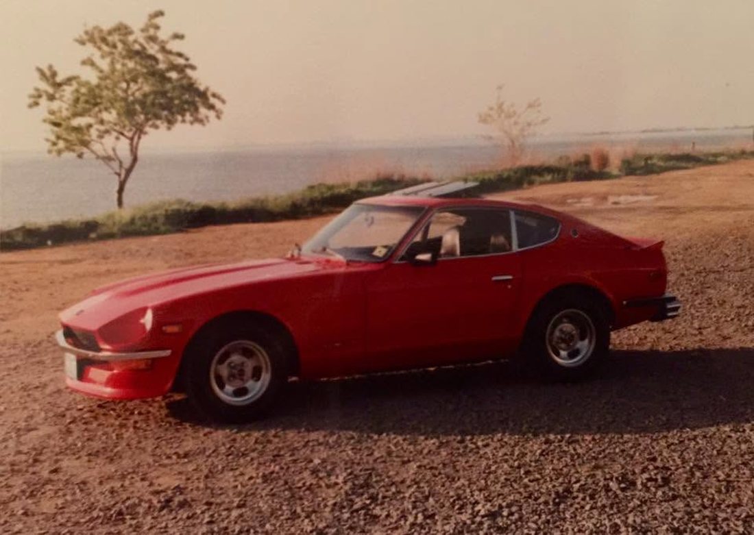 Erik's first car, a red 1971 Datsun 240Z, photographed after he finished restoring it in high school